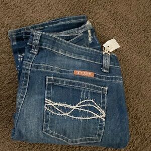 Cowgirl tuff jeans- ain’t my day to care.33x33